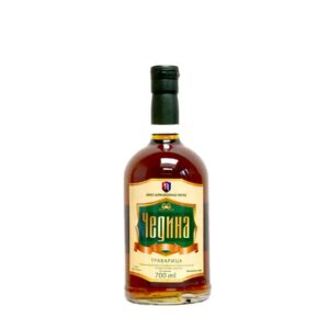 Authentic NDV Rakija herbal spirit in 700ml glass bottle, traditional Balkan beverage.