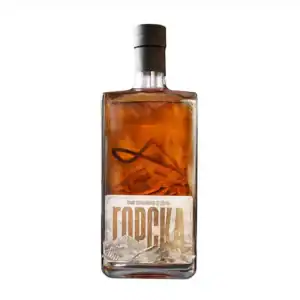 Handcrafted NDV Rakija in a sleek glass bottle with mountain-inspired label.