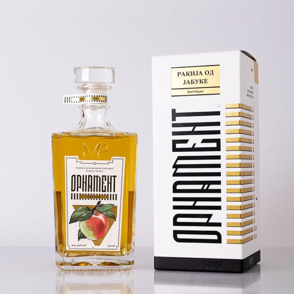Apple flavored rakija in a glass bottle with stylish packaging.