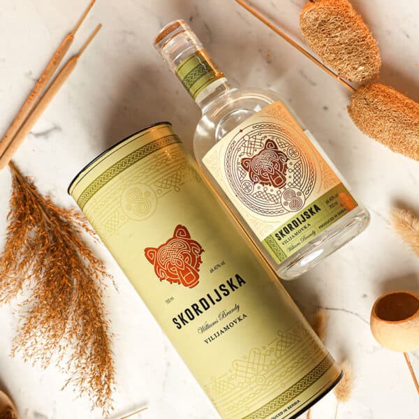 High-quality Skordiska Rakija on a decorative can and bottle, ideal for traditional Slovenian brandy lovers.