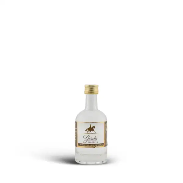High-quality homemade traditional rakija in a small glass bottle. Perfect for authentic Balkan spirits.