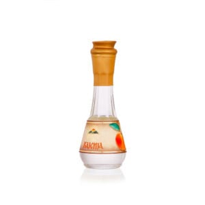 Traditional fruit brandy in a decorative glass bottle with a wooden cap, from Rakija.si.