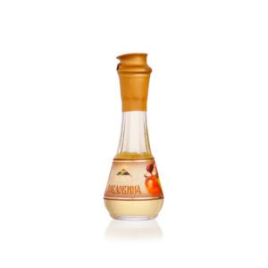 Traditional Slovenian fruit brandy in glass bottle with caramel-colored cap, ideal for authentic Slovenian Rakija experiences.