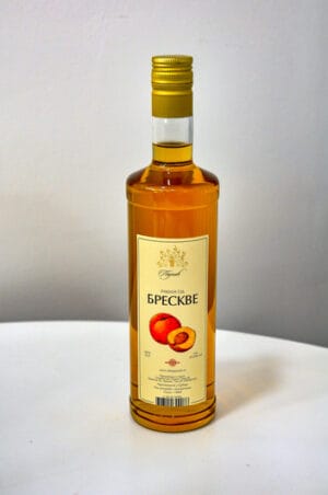 Peach Rakija made from ripe peach fruits, traditional Balkan fruit brandy.