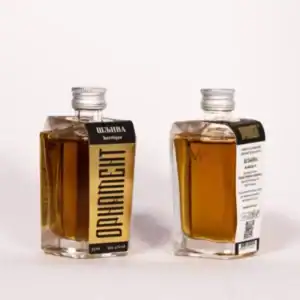 High-quality NDV Rakija in a sleek glass bottle with black label and silver cap.